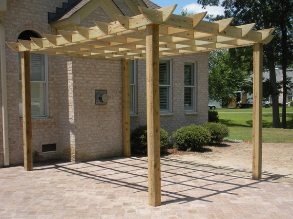 Pergola installation in the back patio of a house.