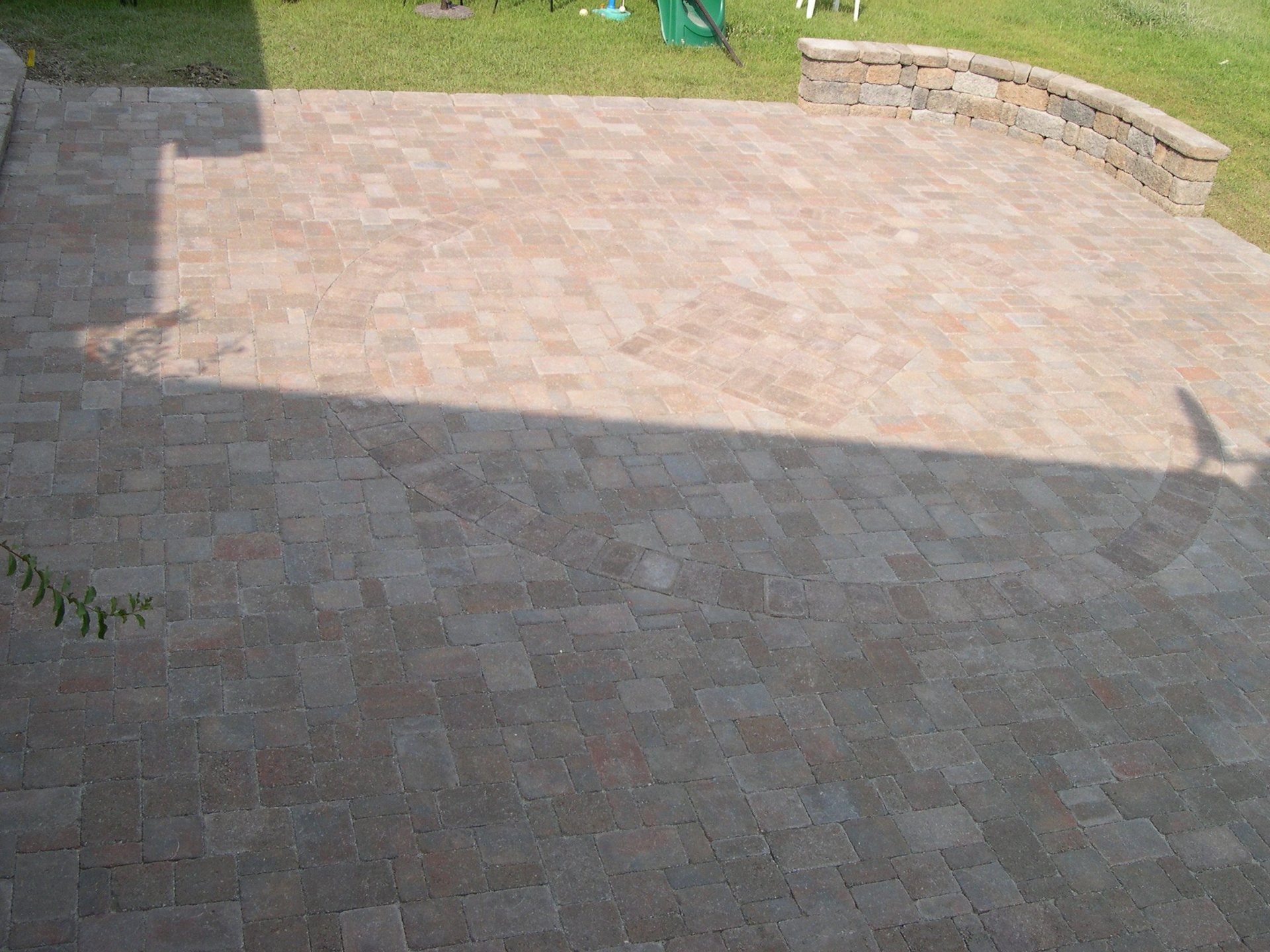 Patio pavers in the backyard of a house.