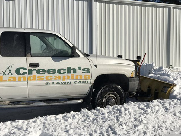 Truck plowing snow.